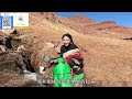 a girl in a pastoral area leaves home to fetch water