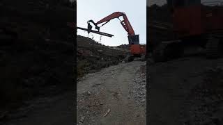 Log loader and grapple yarder working