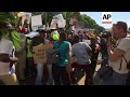 Zimabweans rally against Mugabe outside parliament