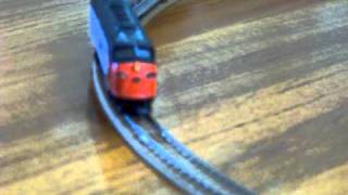 Bachmann Amtrak F9 running with 3 passenger cars.