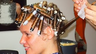 Nice woman with natural straight hair getting a soft roller perm