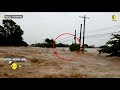 man found stranded in raging floodwaters after typhoon tears across philippines north