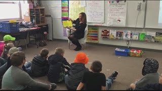 Stacy reads to Shiocton 3rd graders