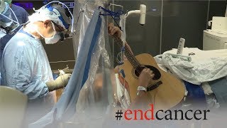 Brain tumor patient plays guitar during awake craniotomy surgery