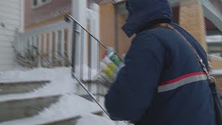 U.S. Postal Carriers fight brutally cold temperatures on the job