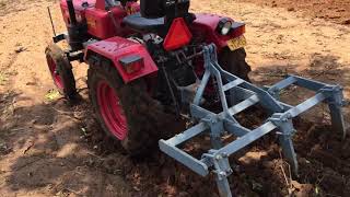 Mini tractor mahindra nxt 215 ploughing better in dry land with average depth 15cm at 16rpm gearload