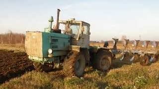 XTZ T-150K ploughing with reversible five furrow plow