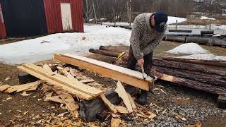 Hewing some new roofboards for an old norwegian outhouse