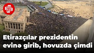 Etirazçılar prezidentin evinə girib, hovuzunda çimdilər