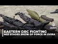 M23 rebels display seized arms in the captured DRC city of Uvira