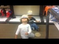 Kai and camila trying on hats