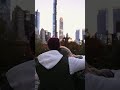 couple 👫 sitting and looking over the city skyline amezing 🏢 building