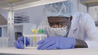 African Scientist Wearing Protective Uniform in Lab | Stock Footage - Envato elements