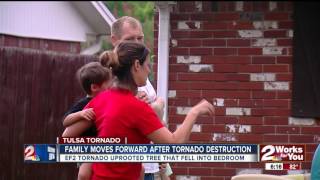 Tornado uproots tree, sends it slamming into home