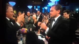 Leo gets a Golden Globe for the Revenant. And an awkward fist bump.