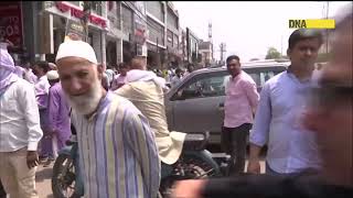 Locals stage sit-in protest to stop anti-encroachment drive in Shaheen Bagh, Delhi