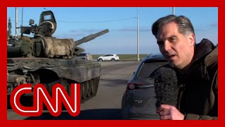 Russian tanks roll past CNN reporter as they appear to head towards Ukraine