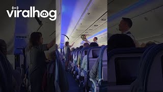 Airliner Ceiling Panel Dislodges During Landing || ViralHog