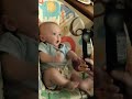 silly baby boy goes crazy over a remote control