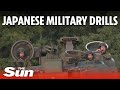 Japanese marines launch assault vehicles from warship during beach landing exercise