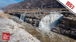 黄河壶口瀑布现冬季彩虹冰挂美景 阳光照射晶莹剔透