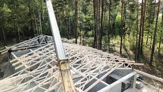 Roof timber trusses for a house in the middle of woods