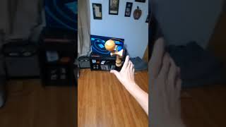 kendama trick- cross arm nightingale trade spike