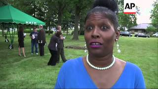 Dozens of family members, clergy, funeral directors and others gathered at a Michigan cemetery to pa