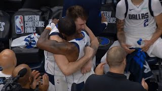 Dallas Mavericks embrace each other during timeout after advancing to NBA Finals