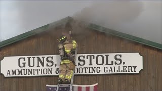 Firefighters battle 2-alarm fire at gun and ammo store in Genesee County