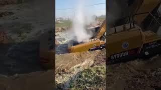 He tries to get the excavator out of the mud