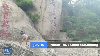 Disabled man handstand walks to the summit of Mount Tai