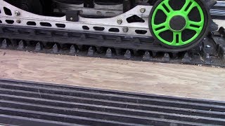 Used snowmobile track made into stud/traction mat.