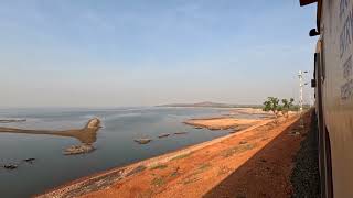 11139/Mumbai CSMT - Hosapete SF Express crossing Krishna river and approaching Almatti dam