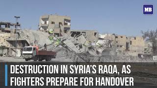 Destruction in Syria's Raqa, as fighters prepare for handover