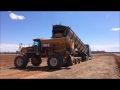 trout river rear lift unloading into lime spreader