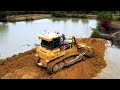 wonderful mighty bulldozer shantui dh17c2​ push land filling up dump truck unloading into water