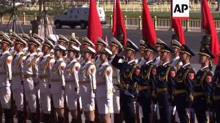 Merkel welcomed by Li at start of state visit