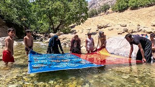 nomadic Family Tradition: Washing Rugs by the Riverside