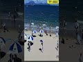 🔴炎炎夏日，阳光沙滩，广东海边，海风佛面，海边纳凉，众多游客在海边游玩！🌍提醒大家注意防范大风、降雨影响。祝大家出行平安！