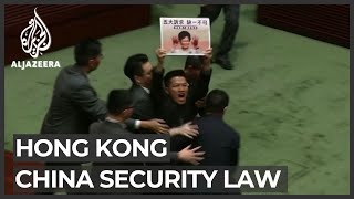 China defends rule that led to Hong Kong politicians' dismissal