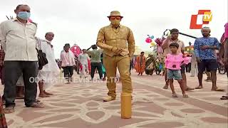 Golden Boy drawing attention of devotees at Puri Badadanda by turning living statue