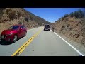 cyclist joins then overtakes motorcycles