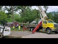 Large tree falls on home, roadway in Muskegon Township