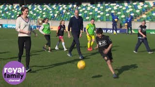 The Duke and Duchess of Cambridge join children on the pitch at Windsor Park, Belfast