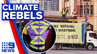 Climate change activists charged after blocking intersection | 9 News Australia