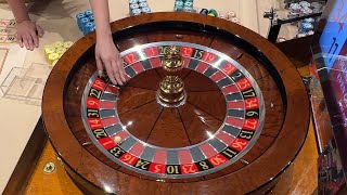 Casino dealer spin tests different size roulette balls