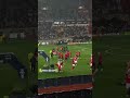 benfica players celebrate winning the league cup against sporting with the mascot