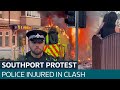 Police injured in clash with suspected EDL supporters outside Southport mosque | ITV News