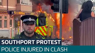 Police injured in clash with suspected EDL supporters outside Southport mosque | ITV News